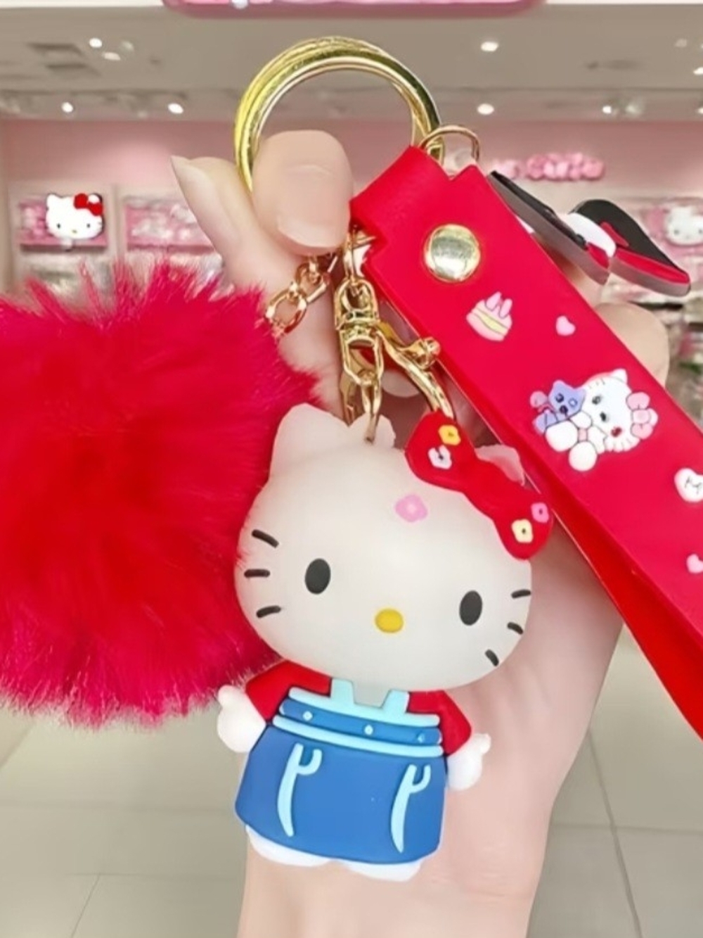 Sanrio Hello Kitty Red Pom-Pom Keyring with Blue Outfit Charm, Keychain. 3-Piece